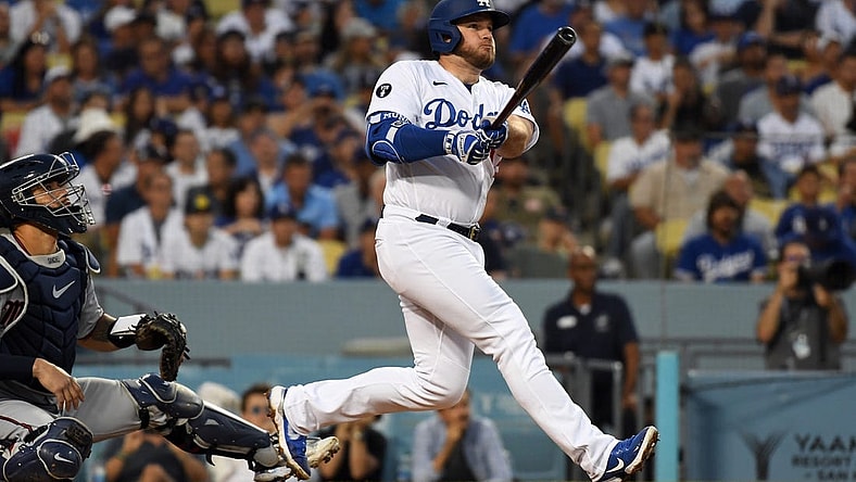 Aug 10, 2022; Los Angeles, California, USA; Los Angeles Dodgers third baseman Max Muncy (13) hits a solo home run in the second inning against the Minnesota Twins at Dodger Stadium. Mandatory Credit: Richard Mackson-USA TODAY Sports