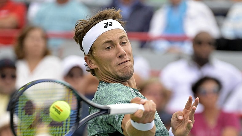 Aug 12, 2022; Montreal, QC, Canada; Casper Ruud (NOR) hits a forehand against Felix Auger-Aliassime (CAN) (not pictured) in quarterfinal play in the National Bank Open at IGA Stadium. Mandatory Credit: Eric Bolte-USA TODAY Sports