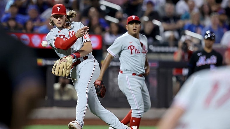 Aug 12, 2022; New York City, New York, USA; Philadelphia Phillies third baseman Alec Bohm (28) throws to first after fielding a ground ball by New York Mets right fielder Starling Marte (not pictured) with his bare hand during the sixth inning at Citi Field. Mandatory Credit: Brad Penner-USA TODAY Sports
