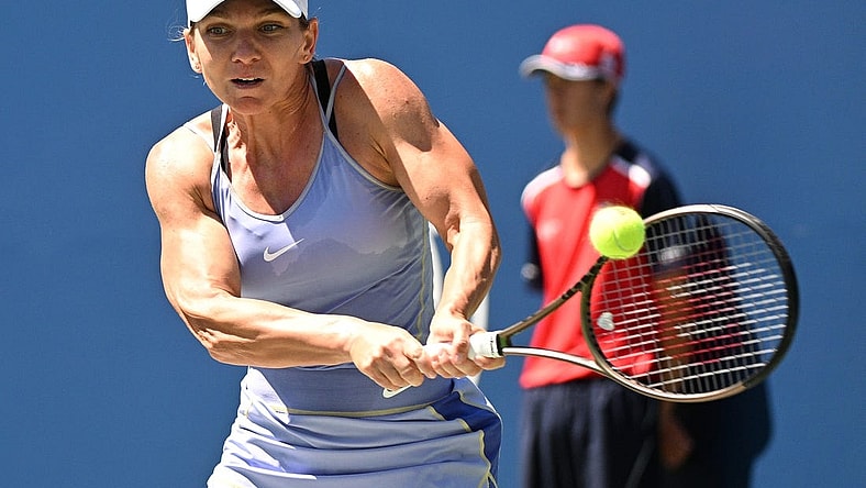 Aug 13, 2022; Toronto, ON, Canada;  Simona Halep (ROU)   plays a shot against Jessica Pegula (USA) (not pictured) at Sobeys Stadium. Mandatory Credit: Dan Hamilton-USA TODAY Sports