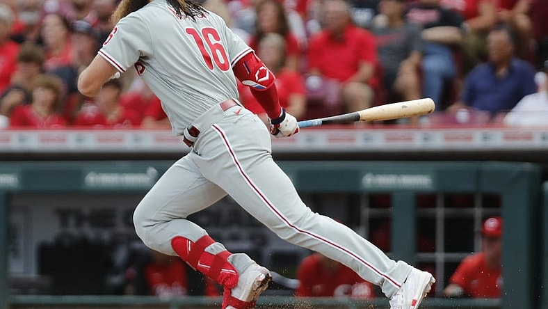 Aug 15, 2022; Cincinnati, Ohio, USA; Philadelphia Phillies center fielder Brandon Marsh (16) hits a single against the Cincinnati Reds during the second inning at Great American Ball Park. Mandatory Credit: David Kohl-USA TODAY Sports