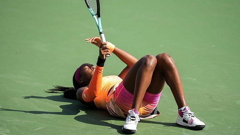 Coco Gauff falls after rushing to get the ball during her match against Marle Bouzkova on the Grand Stand court at the 2022 Western & Southern Open on Tuesday August 16. Gauff forfeit during the second set after receiving an injury.