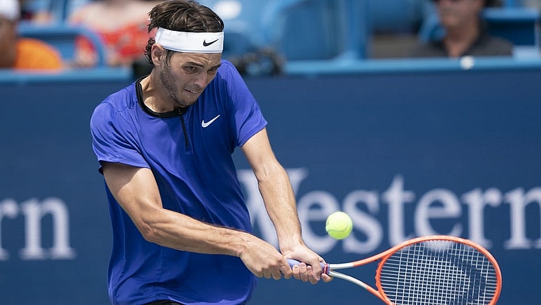 Aug 18, 2022; Cincinnati, OH, USA; Taylor Fritz (USA) returns a shot during his match against Andrey Rublev (RUS) at the Western & Southern Open at the at the Lindner Family Tennis Center. Mandatory Credit: Susan Mullane-USA TODAY Sports