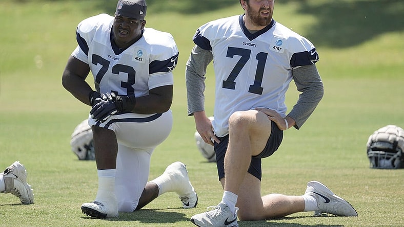 Aug 18, 2022; Costa Mesa, CA, USA; Dallas Cowboys offensive tackle Tyler Smith (73) and offensive tackle Matt Waletzko (71) stretch during joint practice against the Los Angeles Chargers at Jack Hammett Sports Complex. Mandatory Credit: Kirby Lee-USA TODAY Sports