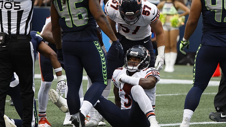 Aug 18, 2022; Seattle, Washington, USA; Chicago Bears safety Elijah Hicks (37) is helped up by teammates, including linebacker Jack Sanborn (57), after recovering a fumble for a touchdown against the Seattle Seahawks during the second quarter at Lumen Field. Mandatory Credit: Joe Nicholson-USA TODAY Sports