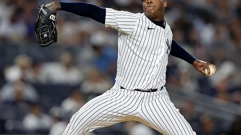 Aug 19, 2022; Bronx, New York, USA; New York Yankees relief pitcher Aroldis Chapman (54) pitches against the Toronto Blue Jays during the ninth inning at Yankee Stadium. Mandatory Credit: Brad Penner-USA TODAY Sports