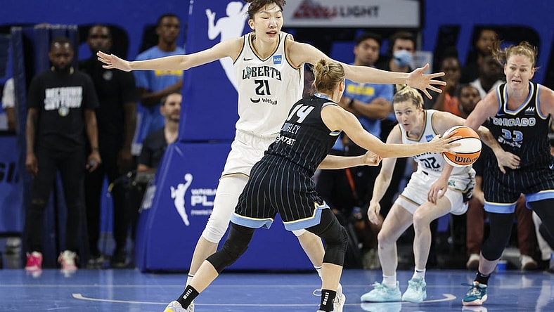 Aug 20, 2022; Chicago, Illinois, USA; New York Liberty center Han Xu (21) defends against Chicago Sky guard Allie Quigley (14) during the first half of Game 2 of the first round of the WNBA playoffs at Wintrust Arena. Mandatory Credit: Kamil Krzaczynski-USA TODAY Sports