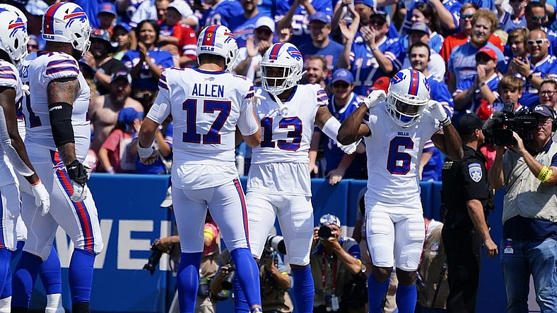 Aug 20, 2022; Orchard Park, New York, USA; Buffalo Bills quarterback Josh Allen (17) congratulates Buffalo Bills wide receiver Gabriel Davis (13) for catching a touchdown pass during the first half against the Denver Broncos at Highmark Stadium. Mandatory Credit: Gregory Fisher-USA TODAY Sports
