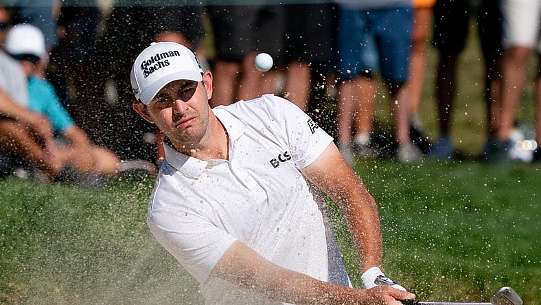 Aug 20, 2022; Wilmington, Delaware, USA; Patrick Cantlay plays a shot from a bunker on the 15th hole during the third round of the BMW Championship golf tournament. Mandatory Credit: Bill Streicher-USA TODAY Sports