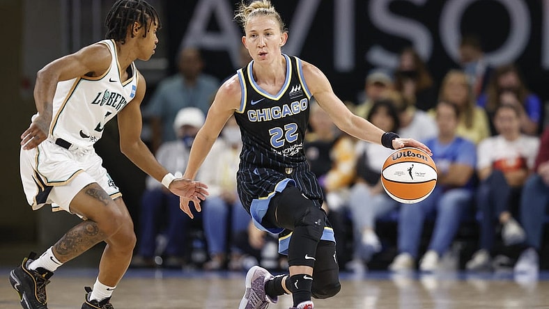 Aug 20, 2022; Chicago, Illinois, USA; Chicago Sky guard Courtney Vandersloot (22) is defended by New York Liberty guard Crystal Dangerfield (3) during the first half of Game 2 of the first round of the WNBA playoffs at Wintrust Arena. Mandatory Credit: Kamil Krzaczynski-USA TODAY Sports