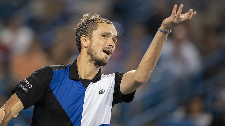 Aug 20, 2022; Cincinnati, OH, USA; Daniil Medvedev (RUS) serves against Stefanos Tsitsipas (GRE) at the Western & Southern Open at the Lindner Family Tennis Center. Mandatory Credit: Susan Mullane-USA TODAY Sports