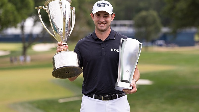 Aug 21, 2022; Wilmington, Delaware, USA; Patrick Cantlay poses with the BMW and Western Golf Association trophies after winning the BMW Championship golf tournament. Mandatory Credit: Bill Streicher-USA TODAY Sports