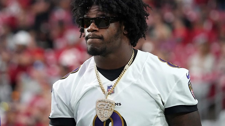 Aug 21, 2022; Glendale, Arizona, USA; Baltimore Ravens quarterback Lamar Jackson (8) looks on against the Arizona Cardinals during the first half at State Farm Stadium. Mandatory Credit: Joe Camporeale-USA TODAY Sports