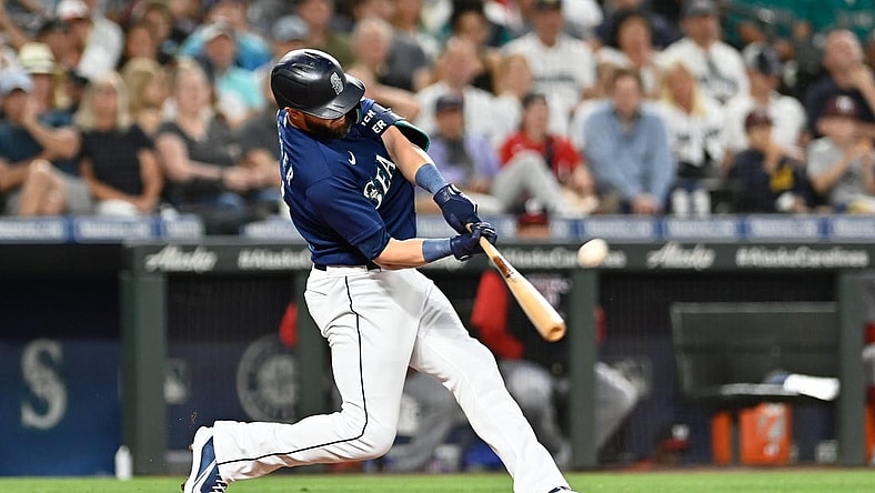 Aug 23, 2022; Seattle, Washington, USA; Seattle Mariners right fielder Mitch Haniger (17) hits a two-run home run against the Washington Nationals during the fourth inning at T-Mobile Park. Mandatory Credit: Steven Bisig-USA TODAY Sports