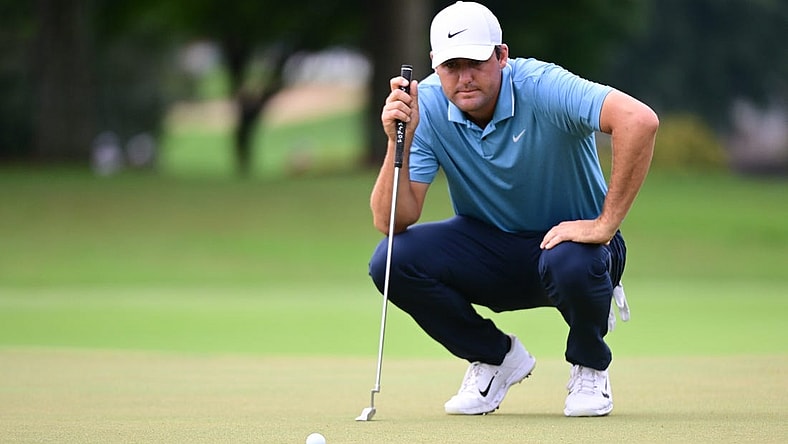 Aug 25, 2022; Atlanta, Georgia, USA; Scott Scheffler lines a putt on the 1st green during the first round of the TOUR Championship golf tournament. Mandatory Credit: Adam Hagy-USA TODAY Sports