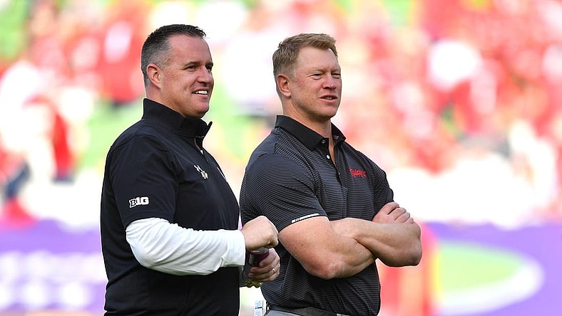 Aug 27, 2022; Dublin, IRELAND; Northwestern Wildcats head coach Pat Fitzgerald, left, and Nebraska Cornhuskers head coach Scott Frost on the field before the Aer Lingus college football series at Aviva Stadium. Mandatory Credit: Brendan Moran-USA TODAY Sports