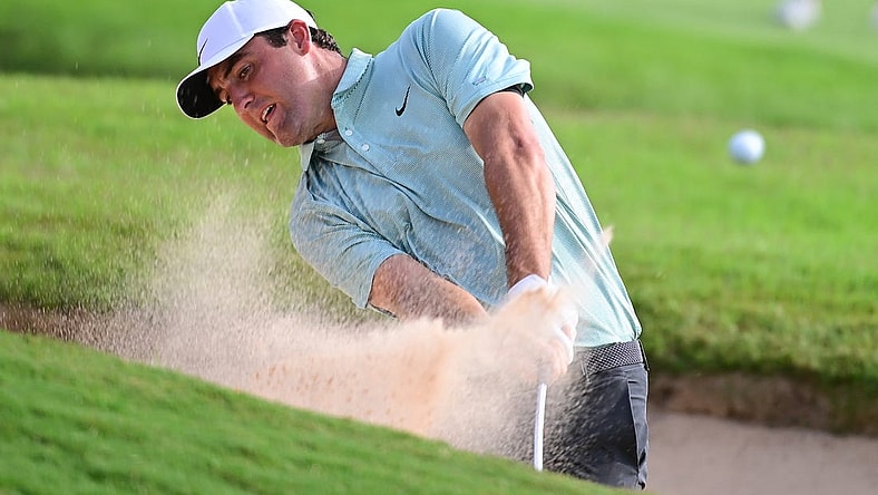 Aug 27, 2022; Atlanta, Georgia, USA; Scottie Scheffler hits from the sand on the 8th hole during the third round of the TOUR Championship golf tournament. Mandatory Credit: Adam Hagy-USA TODAY Sports