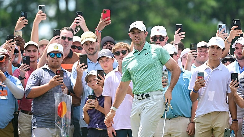 Aug 28, 2022; Atlanta, Georgia, USA; Rory McIlroy watches his chip attempt onto the 1st green during the final round of the TOUR Championship golf tournament. Mandatory Credit: Adam Hagy-USA TODAY Sports