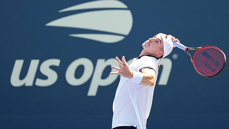 Aug 30, 2022; Flushing, NY, USA; John Isner of the United States serves to Federico Delbonis of Argentina on day two of the 2022 U.S. Open tennis tournament at USTA Billie Jean King National Tennis Center. Mandatory Credit: Danielle Parhizkaran-USA TODAY Sports