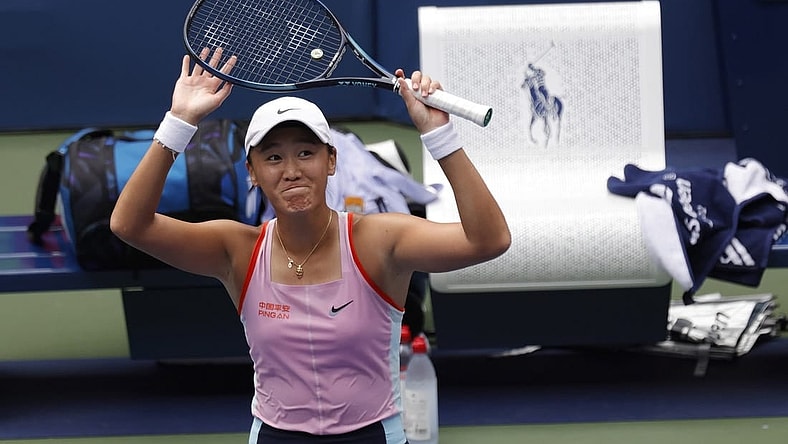 Aug 31, 2022; Flushing, NY, USA; Xiyu Wang (CHN) waves to the crowd after her match against Maria Sakkari (GRE) (not pictured) on day three of the 2022 U.S. Open tennis tournament at USTA Billie Jean King Tennis Center. Mandatory Credit: Geoff Burke-USA TODAY Sports