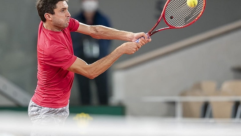 Sep 29, Paris, France; Gilles Simon (FRA) in action during his match against Denis Shapovalov (CAN) on day three at Stade Roland Garros. Mandatory Credit: Susan Mullane-USA TODAY Sports