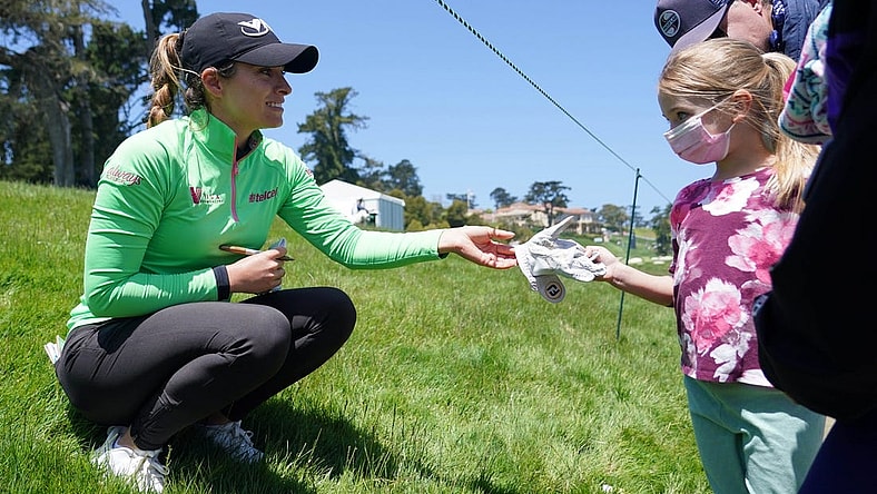 Jun 6, 2021; San Francisco, California, USA; Gaby Lopez gives a signed glove to a young golf spectator during the final round of the U.S. Women's Open golf tournament at The Olympic Club. Mandatory Credit: Kyle Terada-USA TODAY Sports