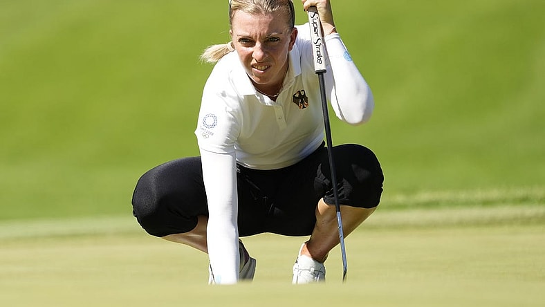 Aug 5, 2021; Tokyo, Japan; Sophia Popov (GER) prepares to putt on the fourth green during the second round of the women's individual stroke play of the Tokyo 2020 Olympic Summer Games at Kasumigaseki Country Club. Mandatory Credit: Michael Madrid-USA TODAY Sports
