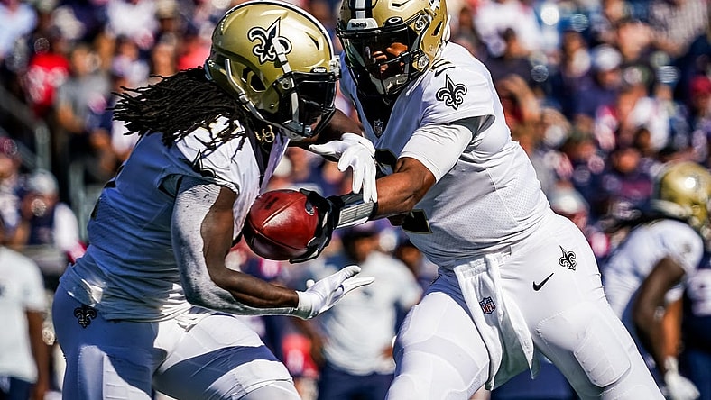 Sep 26, 2021; Foxborough, Massachusetts, USA; New Orleans Saints quarterback Jameis Winston (2) hands off the ball to running back Alvin Kamara (41) against the New England Patriots during the second half at Gillette Stadium. Mandatory Credit: David Butler II-USA TODAY Sports