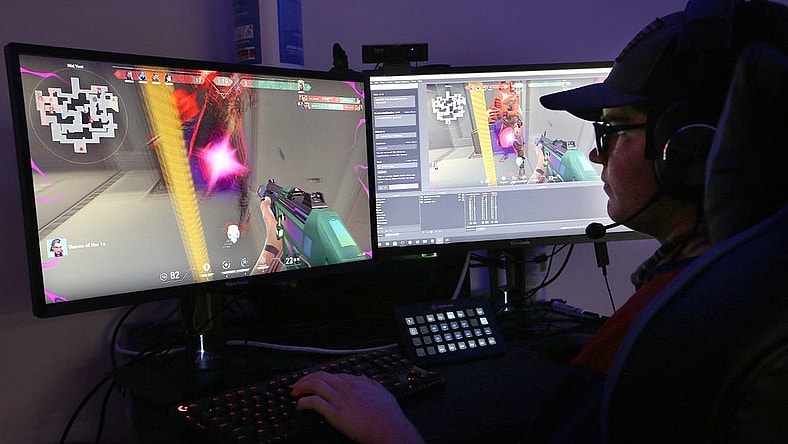 Clayton Huston watches and does play by play during the game 'Valorant' with his Hutchinson Community College esports teammates as they competed against Shelton State Community College on Thursday evening, Oct. 7, 2021.

Hut 101521 Hcc Esports 06