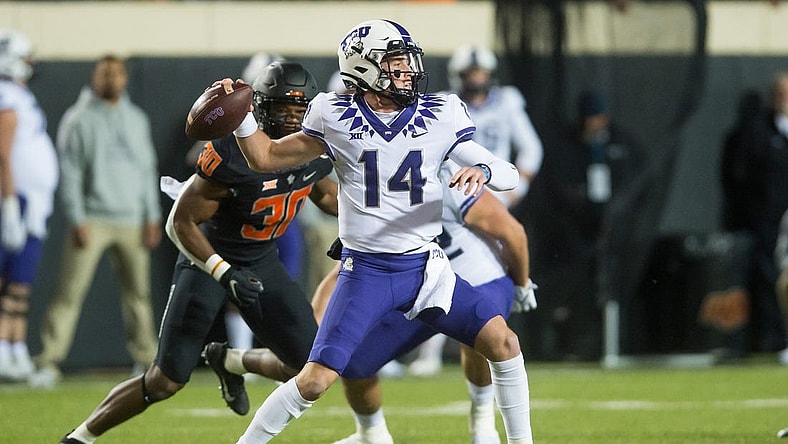 Nov 13, 2021; Stillwater, Oklahoma, USA;  TCU Horned Frogs quarterback Chandler Morris (14) throws a pass during the first quarter against the Oklahoma State Cowboys at Boone Pickens Stadium. Mandatory Credit: Brett Rojo-USA TODAY Sports