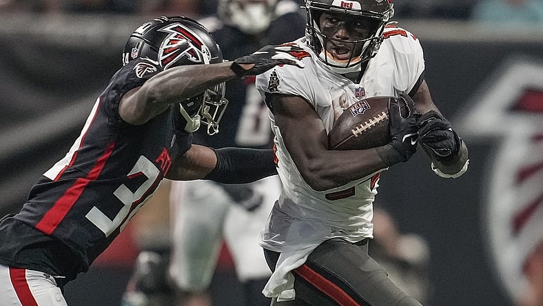 Dec 5, 2021; Atlanta, Georgia, USA; Tampa Bay Buccaneers wide receiver Chris Godwin (14) runs against Atlanta Falcons cornerback Darren Hall (34) during the first half at Mercedes-Benz Stadium. Mandatory Credit: Dale Zanine-USA TODAY Sports