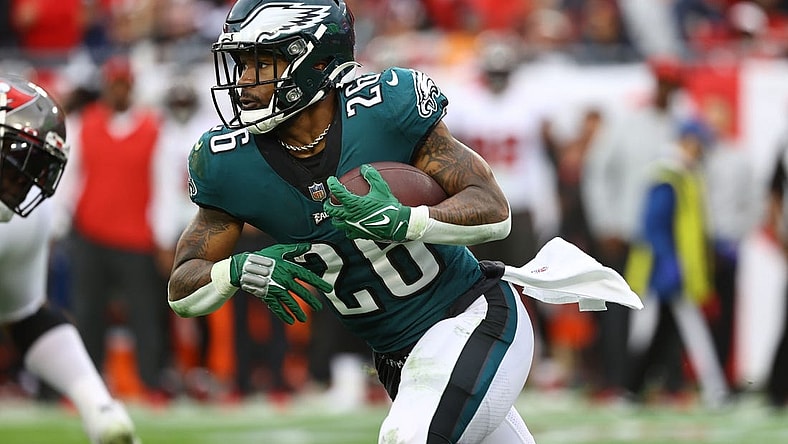 Jan 16, 2022; Tampa, Florida, USA; Philadelphia Eagles running back Miles Sanders (26) runs with the ball against the Tampa Bay Buccaneers during the second half in a NFC Wild Card playoff football game at Raymond James Stadium. Mandatory Credit: Kim Klement-USA TODAY Sports