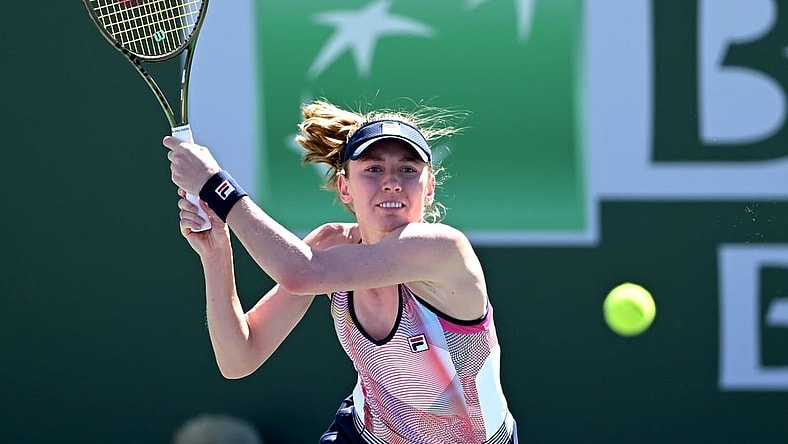 Mar 11, 2022; Indian Wells, CA, USA; Ekaterina Alexandrova (RUS) hits a shot in her 2nd round match against Simona Halep (ROU) at the BNP Paribas Open at the Indian Wells Tennis Garden. Mandatory Credit: Jayne Kamin-Oncea-USA TODAY Sports