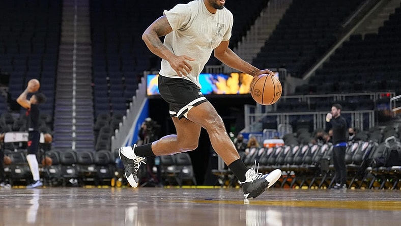 Mar 8, 2022; San Francisco, California, USA; LA Clippers forward Kawhi Leonard (2) warms up before the game against the Golden State Warriors at Chase Center. Mandatory Credit: Darren Yamashita-USA TODAY Sports