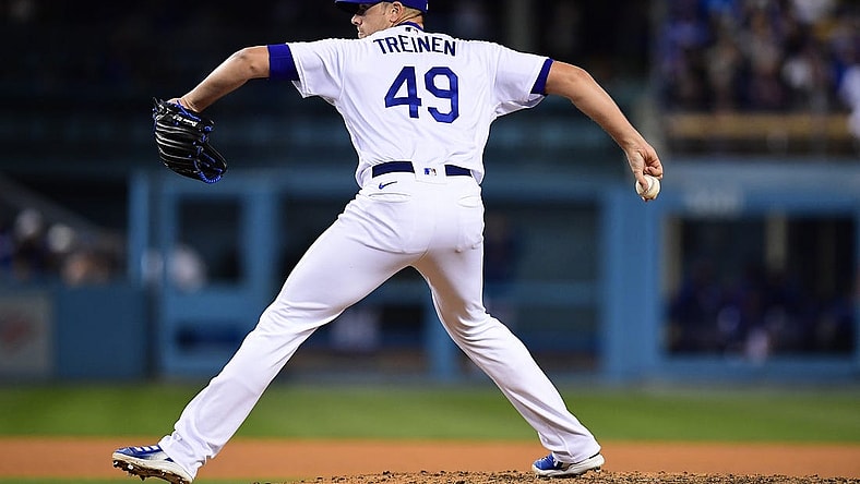 Apr 14, 2022; Los Angeles, California, USA; Los Angeles Dodgers relief pitcher Blake Treinen (49) throws against the Cincinnati Reds during the eighth inning at Dodger Stadium. Mandatory Credit: Gary A. Vasquez-USA TODAY Sports