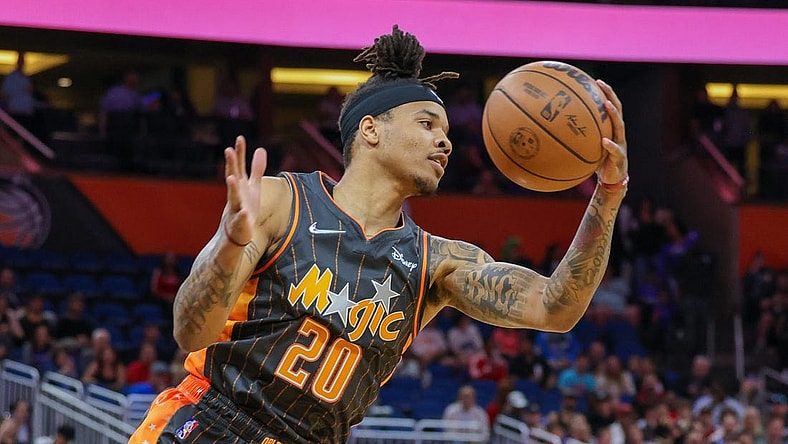 Apr 10, 2022; Orlando, Florida, USA; Orlando Magic guard Markelle Fultz (20) grabs the rebound against the Miami Heat during the first quarter at Amway Center. Mandatory Credit: Mike Watters-USA TODAY Sports