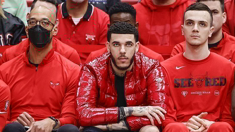 Apr 22, 2022; Chicago, Illinois, USA; Chicago Bulls guard Lonzo Ball (center) looks on from the bench during the second half of game three of the first round for the 2022 NBA playoffs against the Milwaukee Bucks at United Center. Mandatory Credit: Kamil Krzaczynski-USA TODAY Sports