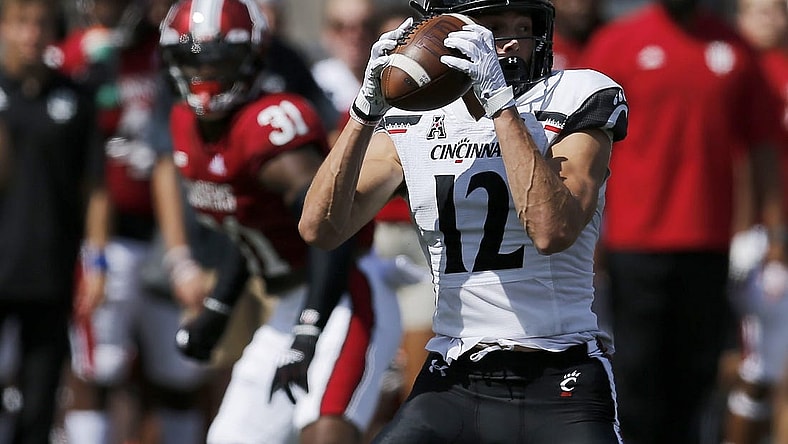 Cincinnati Bearcats wide receiver Alec Pierce (12) catches a short pass in the second quarter of the NCAA football game between the Indiana Hoosiers and the Cincinnati Bearcats at Memorial Stadium in Bloomington, Ind., on Saturday, Sept. 18, 2021.

Syndication The Enquirer