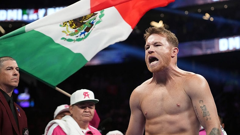May 7, 2022; Las Vegas, Nevada, USA; Canelo Alvarez enters the arena to face Dimitry Bivol (not pictured) in their light heavyweight championship bout at T-Mobile Arena. Mandatory Credit: Joe Camporeale-USA TODAY Sports