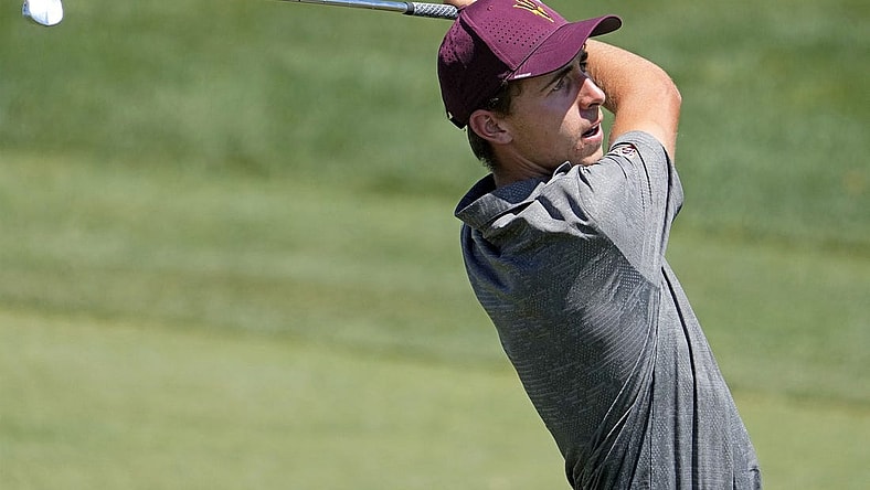 Jun 1, 2022; Scottsdale, Arizona, USA; David Puig of Arizona State plays his second shot on the first hole against opponent Mason Nome of Texas during the final round of match play in the NCAA DI Mens Golf Championships at Grayhawk Golf Club - Raptor Course. Mandatory Credit: Rob Schumacher-Arizona Republic

Golf Ncaa Di Mens Golf Championships