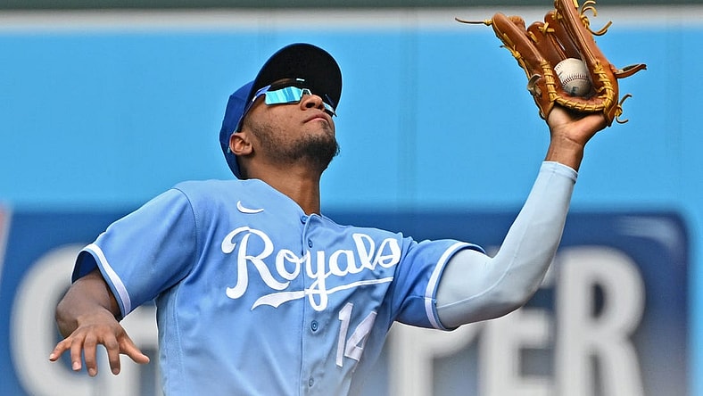 Jun 25, 2022; Kansas City, Missouri, USA; Kansas City Royals right fielder Edward Olivares (14) catches a fly ball in foul territory during the third inning against the Oakland Athletics at Kauffman Stadium. Mandatory Credit: Peter Aiken-USA TODAY Sports