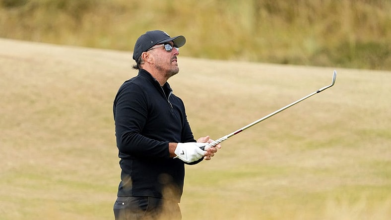 Jul 14, 2022; St. Andrews, SCT; Phil Mickelson takes a shot on the fifth fairway during the first round of the 150th Open Championship golf tournament at St. Andrews Old Course. Mandatory Credit: Rob Schumacher-USA TODAY Sports
