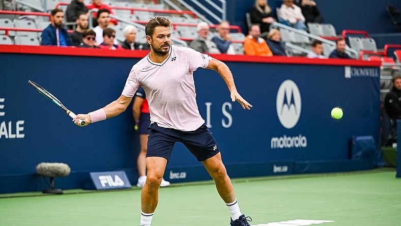 Aug 8, 2022; Montreal, Quebec, Canada; Stan Wawrinka (SUI) hits a shot against Emil Ruusuvuori (FIN) (not pictured) during first round play at IGA Stadium. Mandatory Credit: David Kirouac-USA TODAY Sports