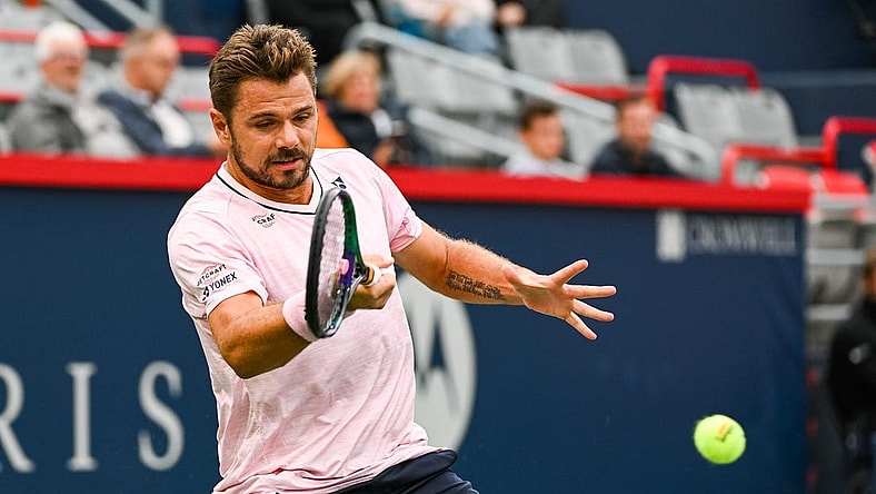 Aug 8, 2022; Montreal, Quebec, Canada; Stan Wawrinka (SUI) hits a shot against Emil Ruusuvuori (FIN) (not pictured) during first round play at IGA Stadium. Mandatory Credit: David Kirouac-USA TODAY Sports