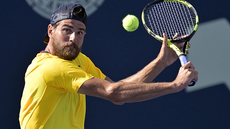 Aug 10, 2022; Montreal, QC, Canada; Maxime Cressy (USA) hits a backhand against Gael Monfils (FRA) (not pictured) in second round play at IGA Stadium. Mandatory Credit: Eric Bolte-USA TODAY Sports