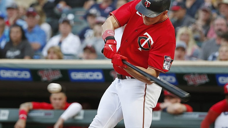 Aug 15, 2022; Minneapolis, Minnesota, USA; Minnesota Twins right fielder Max Kepler (26) hits an RBI single against the Kansas City Royals in the second inning at Target Field. Mandatory Credit: Bruce Kluckhohn-USA TODAY Sports