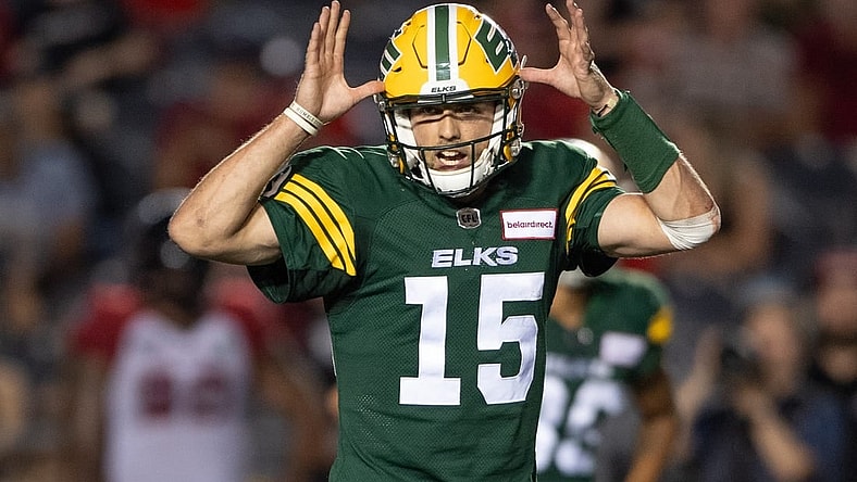 Aug 19, 2022; Ottawa, Ontario, CAN; Edmonton Elks quarterback Taylor Cornelius (15) calls a play in the second half against the Ottawa REDBLACKS at the TD Place stadium. Mandatory Credit: Marc DesRosiers-USA TODAY Sports