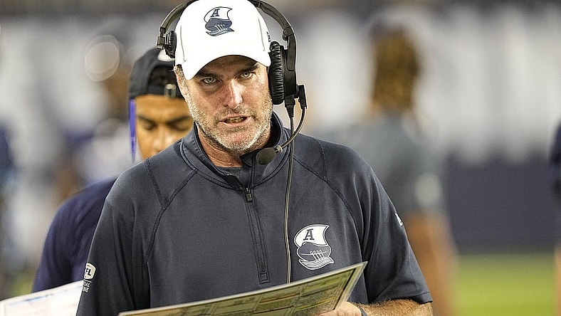 Aug 20, 2022; Toronto, Ontario, CAN; Toronto Argonauts head coach Ryan Dinwiddie talks on his headset during the second half against the Calgary Stampeders at BMO Field. Mandatory Credit: John E. Sokolowski-USA TODAY Sports