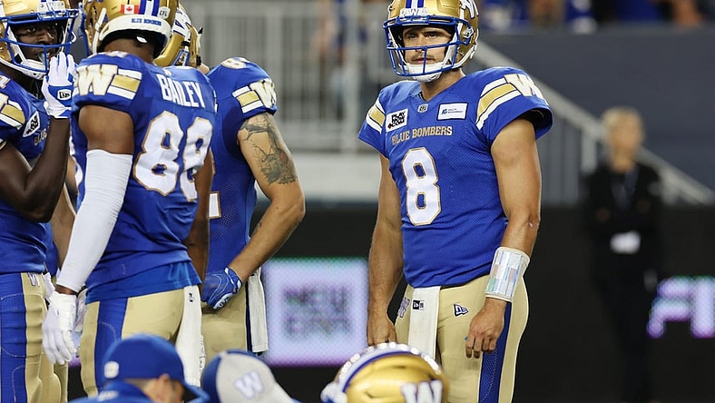 Aug 25, 2022; Winnipeg, Manitoba, CAN;  Winnipeg Blue Bombers quarterback Zach Collaros (8) reacts to an injured teammate during the second half against the Calgary Stampeders at IG Field. Winnipeg wins 31-29. Mandatory Credit: Bruce Fedyck-USA TODAY Sports
