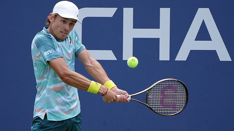 Aug 31, 2022; Flushing, NY, USA;  Alex de Minaur of Australia hits a shot against Cristian Garin of Chile on day three of the 2022 U.S. Open tennis tournament at USTA Billie Jean King Tennis Center. Mandatory Credit: Jerry Lai-USA TODAY Sports